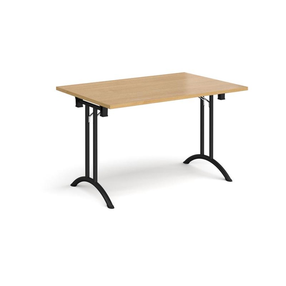 Rectangular folding leg table with black legs and curved foot rails 1200mm x 800mm - oak