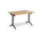 Rectangular folding leg table with black legs and curved foot rails 1200mm x 800mm - oak