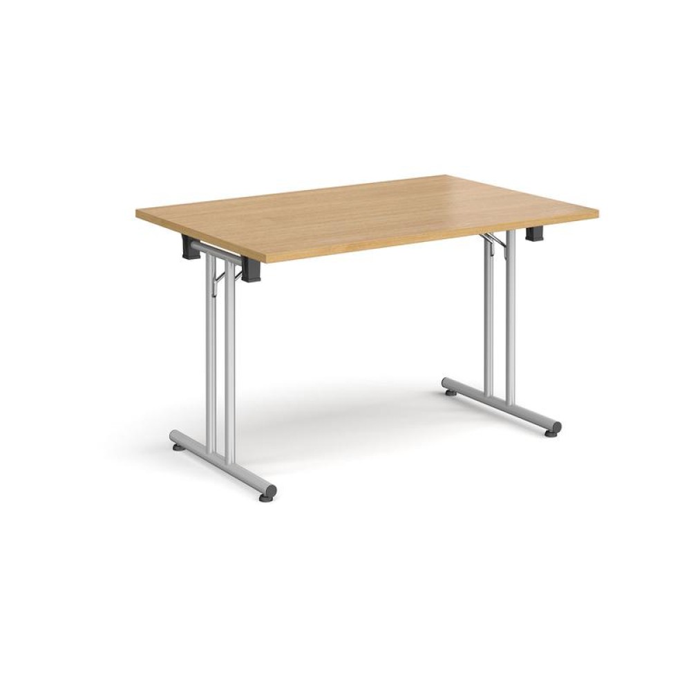 Rectangular folding leg table with silver legs and straight foot rails 1200mm x 800mm - oak